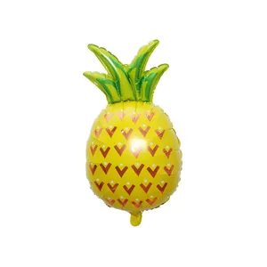 Pineapple shaped foil balloon for tropical themed party decorations in yellow and green