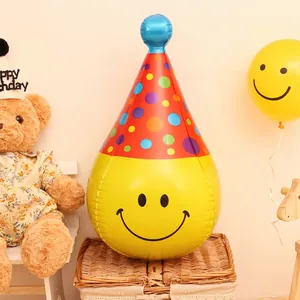 Inflatable yellow smiley face party balloon with red polka dot hat for birthday decor