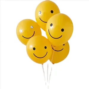 Bunch of yellow latex smiley face balloons for birthday party decorations on white background