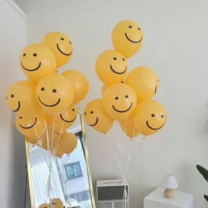 Yellow latex smiley face balloons for party decoration in a modern minimalist indoor setting