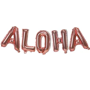 Close-up of rose gold ALOHA foil balloons with metallic finish for tropical party decor