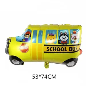 Detail view of yellow school bus foil balloon with cartoon animals for kids party