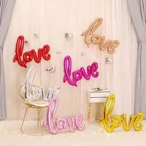 Large cursive LOVE foil balloon in multiple metallic colors for wedding and party decor