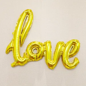Detailed view of the gold foil LOVE letter balloon for wedding and party decorations