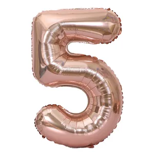 Detail of rose gold number 5 foil balloon with metallic finish for birthday party decor