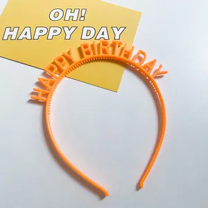 Top view of bright orange Happy Birthday headband for kids party celebrations