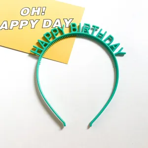 Detail of mint green plastic birthday headband with HAPPY BIRTHDAY letters and non-slip teeth