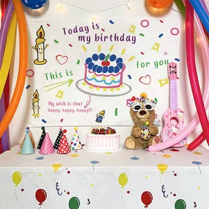 Cartoon birthday party set with illustrated tapestry, festive tablecloth and party hats