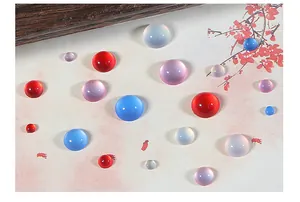Macro detail of cat-eye resin cabochons in various sizes and colors for DIY jewelry