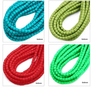 Detail view of 6x6mm square polymer clay spacer beads in four vibrant matte colors