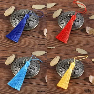 Detail of 8cm silk tassels in royal blue, red, sky blue and golden yellow for DIY crafts