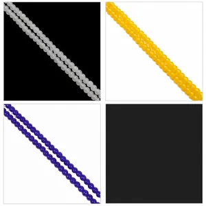 Close-up of 4-10mm smooth glass beads in white, yellow and purple for DIY jewelry making