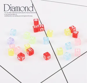 Close-up of colorful acrylic square letter beads for DIY jewelry making and bracelets