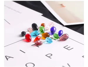 Macro shot of faceted crystal teardrop glass beads in various colors for DIY jewelry making