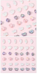 Detailed macro view of baroque iridescent pearl beads in heart and butterfly shapes