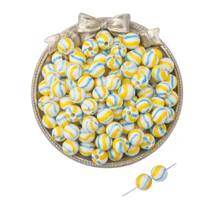 Retro colorful striped ceramic beads in a silver tray for DIY jewelry making and crafts