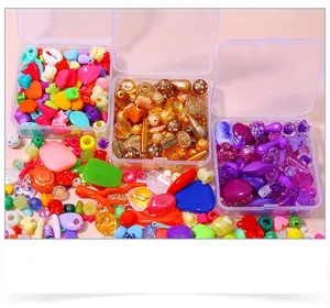 Macro shot of colorful DIY acrylic bead kits in storage boxes for handmade jewelry making