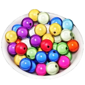 Colorful laser acrylic beads for DIY jewelry making in a white ceramic bowl