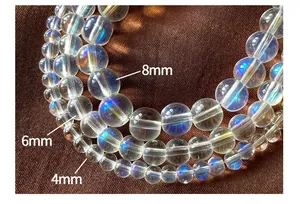 Detail view of 4mm 6mm and 8mm translucent aurora crystal beads for DIY jewelry