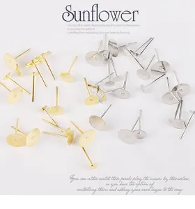 Macro detail of bulk gold and silver flat head earring posts for DIY jewelry making