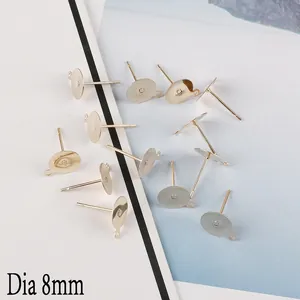 Close-up of 8mm light gold flat base earring studs with loop for DIY jewelry making