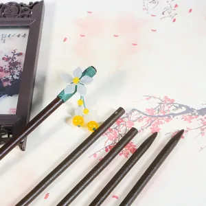 Traditional Chinese wooden hair sticks set with white flower tassels on ink painting background