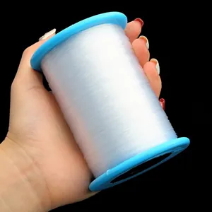 Big roll of clear non-elastic crystal beading wire on a blue spool for DIY jewelry