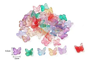 Macro shot of colorful glass-like butterfly beads with glitter for DIY hair accessories