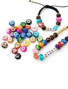 Detailed view of colorful large-hole acrylic flower beads and DIY handmade bracelets