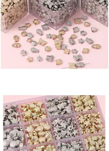 Close-up of gold and silver animal-shaped beads for DIY jewelry making and crafts
