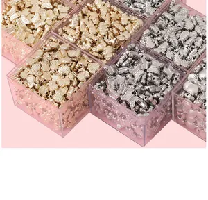 Detailed top view of gold and silver DIY craft beads in a clear plastic organizer box