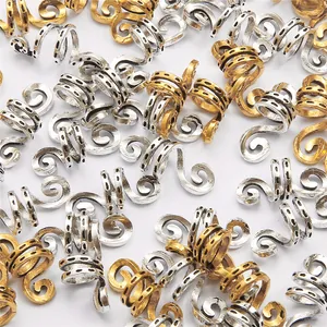 Macro detail of spiral alloy dreadlock beads in gold and silver finish for DIY hair styling