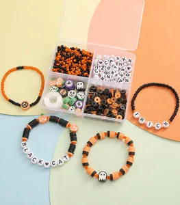 Detail of Halloween DIY bead kit including letter beads and orange soft clay discs