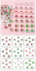 Detail of Christmas glass beads with hand-painted wreaths and snowman patterns for DIY jewelry