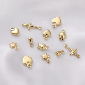 Detailed collection of 14K gold-filled charms in star, heart, and cross shapes for DIY jewelry