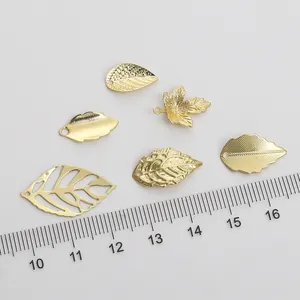 Detail of 14K gold plated hollow leaf charms for DIY jewelry making with ruler scale
