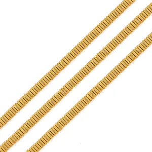 Dettaglio di perline piatte in ematite oro opaco per creazione gioielli fai-da-te