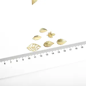 14K gold plated hollow leaf charms in various styles with measurement scale shown