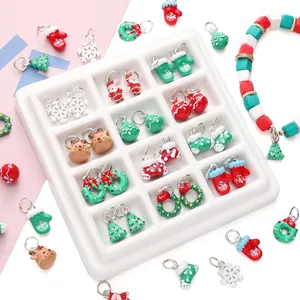 Detailed view of DIY Christmas alloy pendants with Santa, reindeer and tree charms
