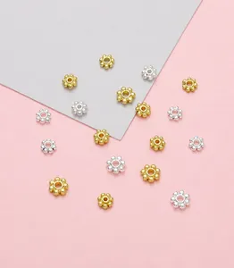 Detail of 14K gold plated snowflake spacer beads for DIY jewelry making accessories
