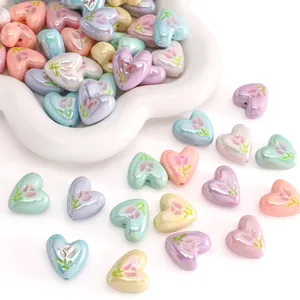 Macro view of macaron heart beads with pearl finish and tulip patterns for DIY jewelry