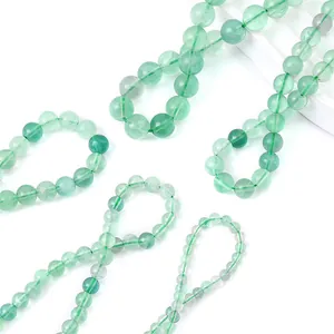 Macro shot of natural green translucent gemstone beads with polished texture for jewelry
