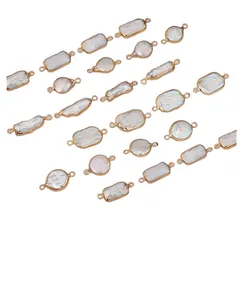 Macro detail of irregular freshwater pearl pendants with gold-plated metal frames