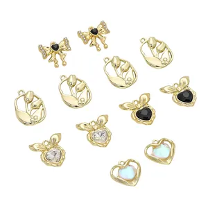 DIY Schmuck-Charm-Set mit goldenen Schleifen, Tulpenrahmen und Herzanhängern mit Strass