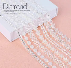Detailed close-up of assorted pearl and rhinestone ribbons for bridal DIY crafts