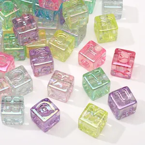 Macro view of iridescent ice-cube letter beads with large holes for DIY jewelry making