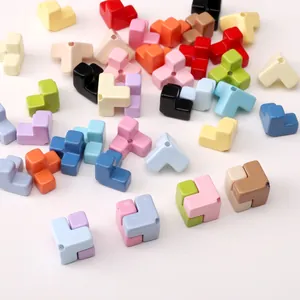 Close-up of colorful Tetris-style acrylic beads with holes for DIY jewelry making