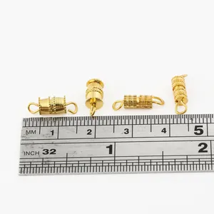 Set of 4 gold screw-in barrel clasps for DIY jewelry with ruler showing 10mm length