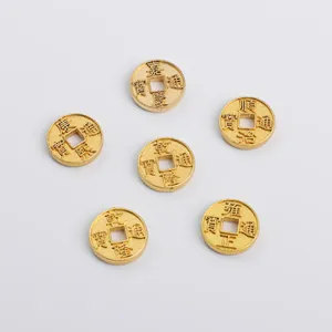 Detailed macro view of six gold-plated zinc alloy coins with traditional embossed characters