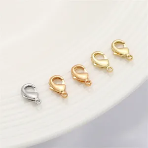 Detail view of 14K gold-plated lobster clasps in various metal finishes for DIY jewelry